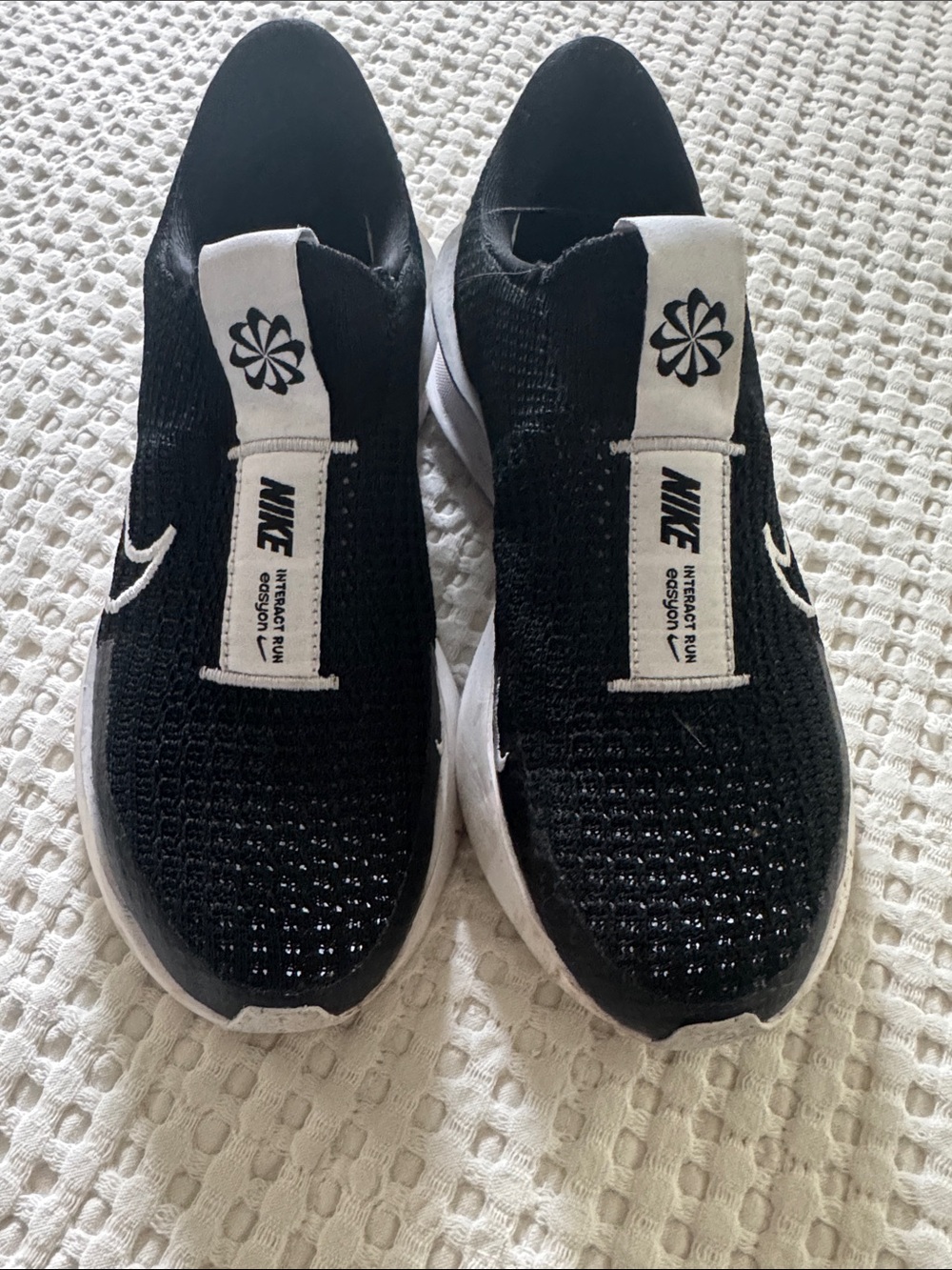 Nike Women’s Black and White Slip-On Knit Sneakers